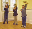 Drei Kinder mit Trompeten (Foto: Stadt Heidelberg)